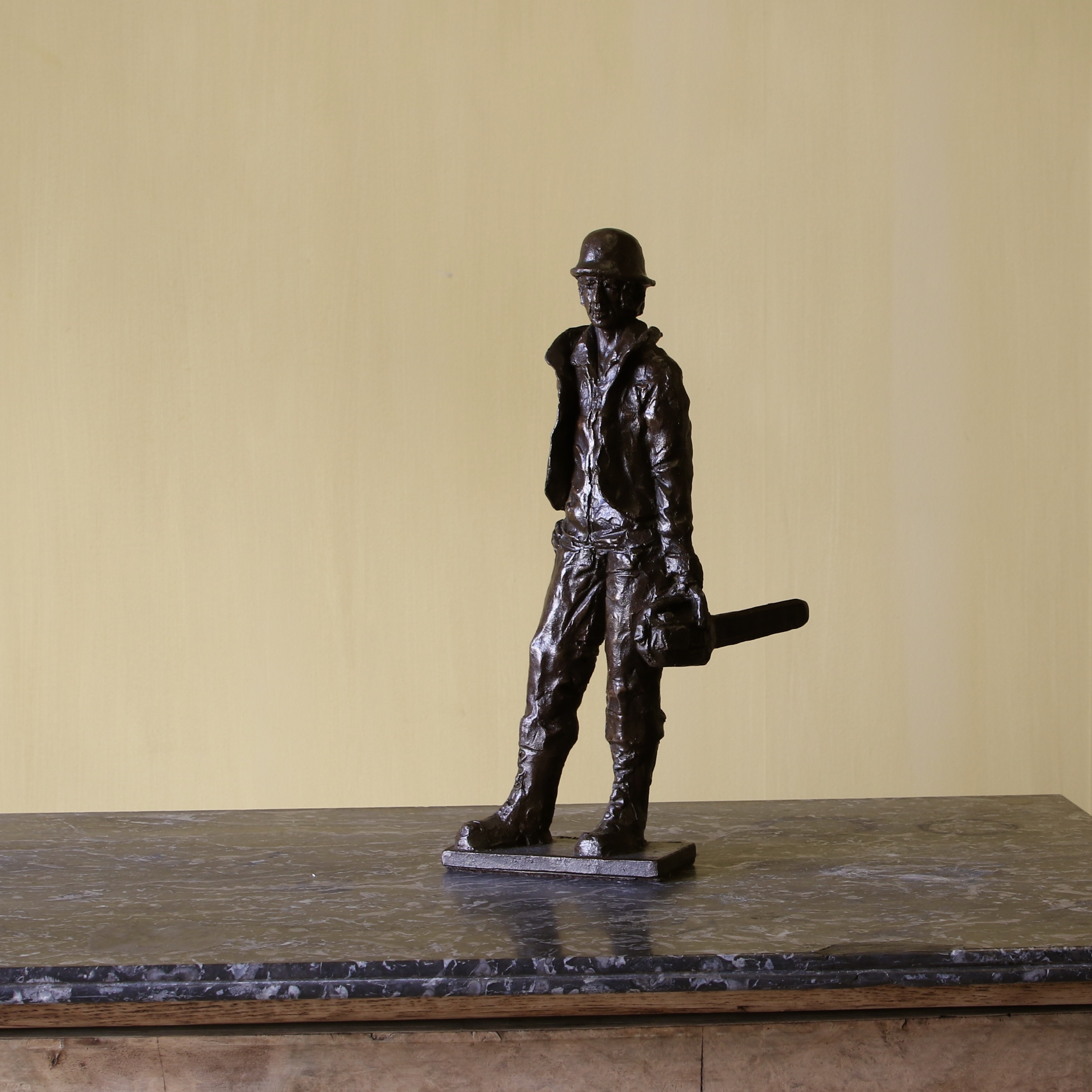 155-90 - Bronze Man with Chainsaw